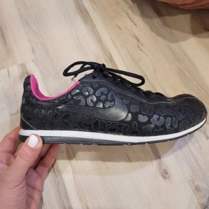 Nike black leopard trainers
